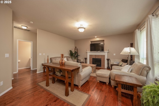 16713 NW Countryridge Dr, Portland, OR 97229 - living room featuring a tile fireplace and wood finished floors