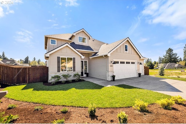 craftsman house with a front lawn and a garage