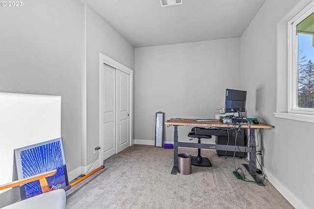 home office featuring light colored carpet