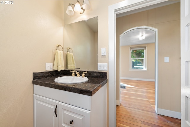 bathroom with vanity and hardwood / wood-style floors