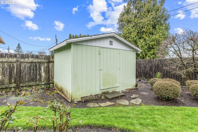 view of shed featuring a fenced backyard