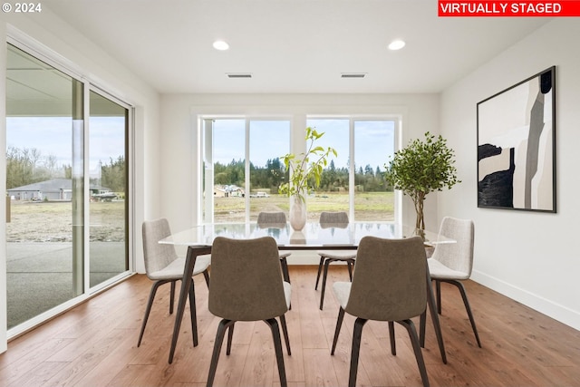 dining space featuring hardwood / wood-style flooring