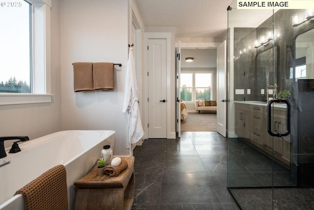 Mountain Home Rd, Sherwood, OR 97140 - ensuite bathroom with a soaking tub, marble finish flooring, baseboards, and vanity