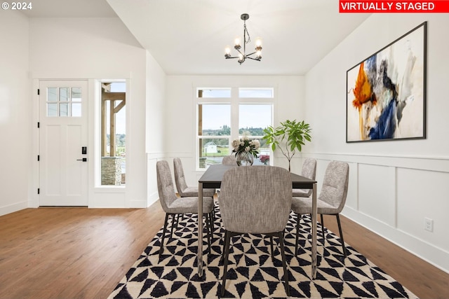 dining room with an inviting chandelier and hardwood / wood-style floors