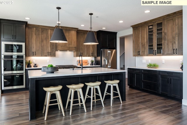 Mountain Home Rd, Sherwood, OR 97140 - kitchen featuring appliances with stainless steel finishes, a sink, backsplash, light countertops, and recessed lighting