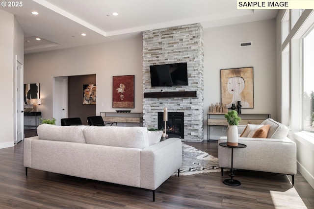 Mountain Home Rd, Sherwood, OR 97140 - living room with dark wood-style floors, a stone fireplace, a high ceiling, baseboards, and recessed lighting