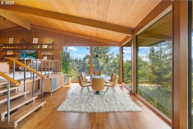 interior space with vaulted ceiling with beams and wood ceiling