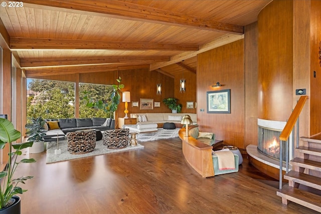 interior space featuring wooden walls, dark wood-type flooring, wooden ceiling, and lofted ceiling with beams