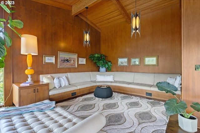 living room featuring wooden walls, hardwood / wood-style floors, wood ceiling, and lofted ceiling with beams