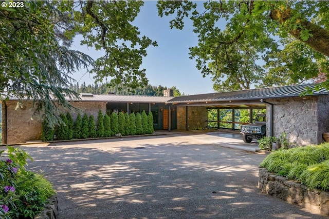 view of front of home with a carport