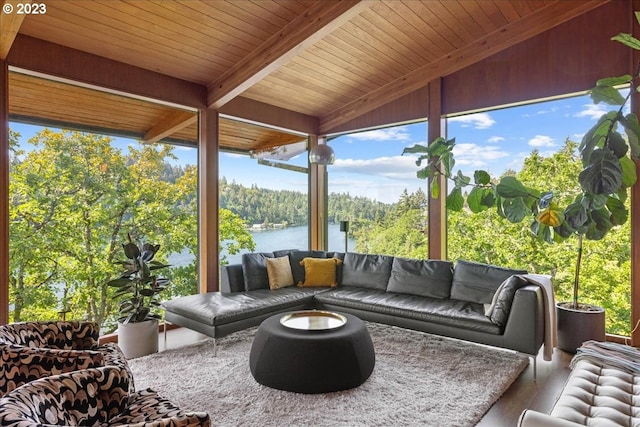 sunroom with a water view, wooden ceiling, and vaulted ceiling with beams