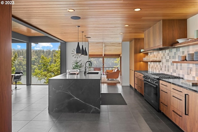 kitchen featuring wooden ceiling, backsplash, hanging light fixtures, gas stove, and sink