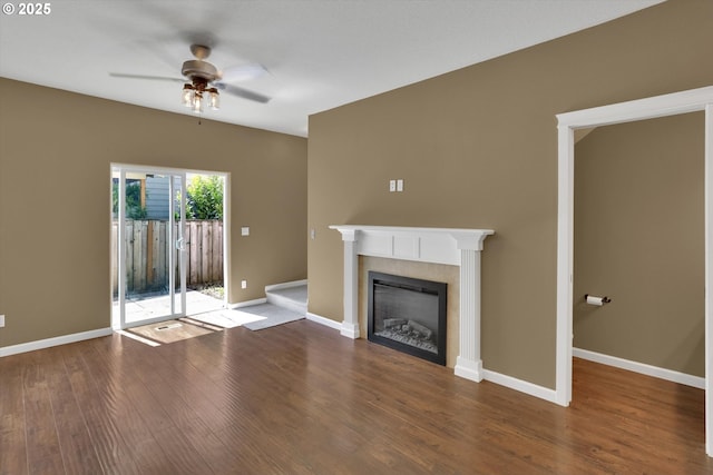 2622 Princeton Pl, Forest Grove, OR 97116 - unfurnished living room with a ceiling fan, wood finished floors, a tiled fireplace, and baseboards
