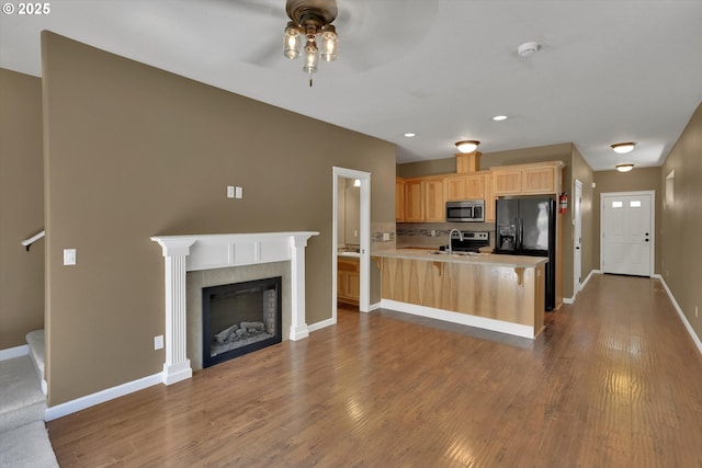 2622 Princeton Pl, Forest Grove, OR 97116 - kitchen with stainless steel appliances, light brown cabinets, a sink, a ceiling fan, and dark wood-type flooring
