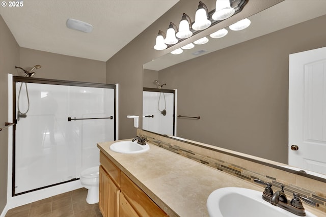 2622 Princeton Pl, Forest Grove, OR 97116 - full bathroom with a stall shower, decorative backsplash, toilet, and double vanity