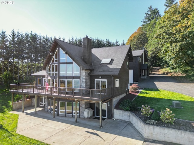 22000 SE Upper Matthews Creek Ln, Amity, OR 97101 - rear view of house featuring a deck, a patio, and a yard