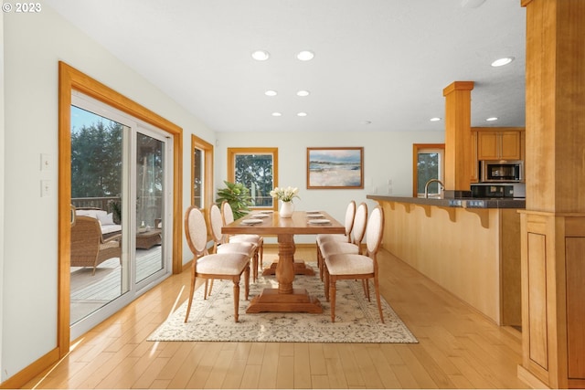22000 SE Upper Matthews Creek Ln, Amity, OR 97101 - dining area featuring light hardwood / wood-style floors, ornate columns, and sink