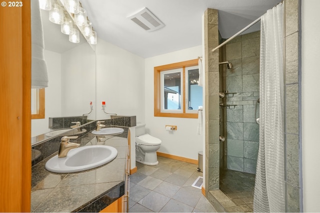 22000 SE Upper Matthews Creek Ln, Amity, OR 97101 - bathroom featuring curtained shower, tile flooring, toilet, vanity with extensive cabinet space, and double sink