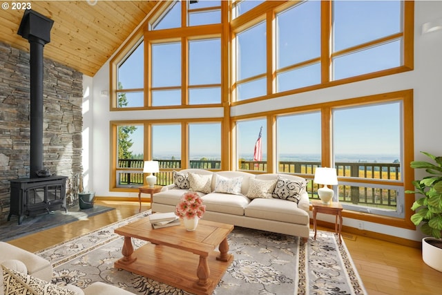22000 SE Upper Matthews Creek Ln, Amity, OR 97101 - living room featuring wooden ceiling, high vaulted ceiling, a wood stove, and light hardwood / wood-style flooring