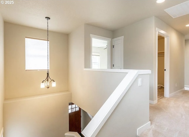 corridor featuring an upstairs landing, light colored carpet, recessed lighting, and baseboards