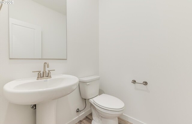 bathroom featuring vanity, hardwood / wood-style floors, and a shower with shower door