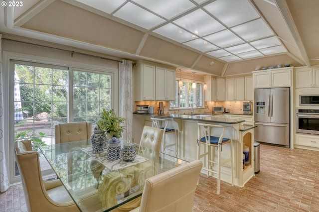 dining space with a healthy amount of sunlight and sink