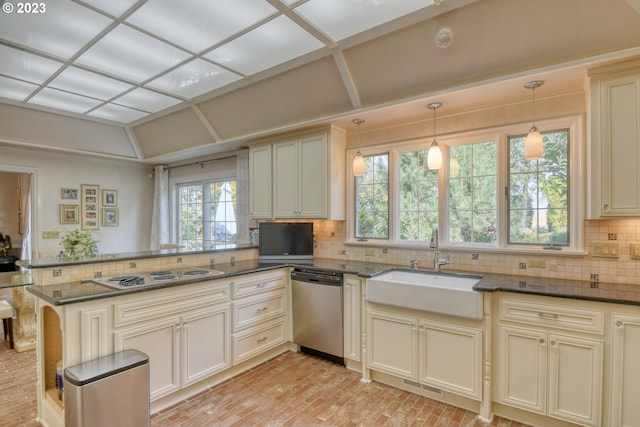 kitchen featuring decorative light fixtures, gas cooktop, tasteful backsplash, kitchen peninsula, and dishwasher