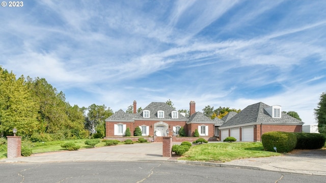 cape cod house featuring a garage