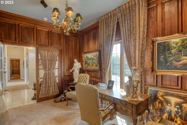 tiled home office featuring a notable chandelier