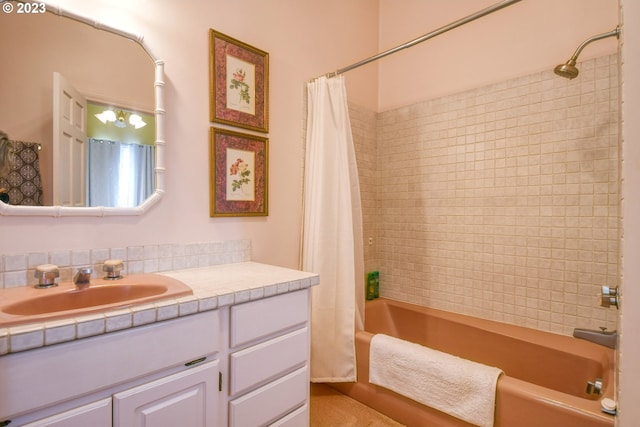 bathroom featuring shower / bath combination with curtain, tasteful backsplash, and oversized vanity