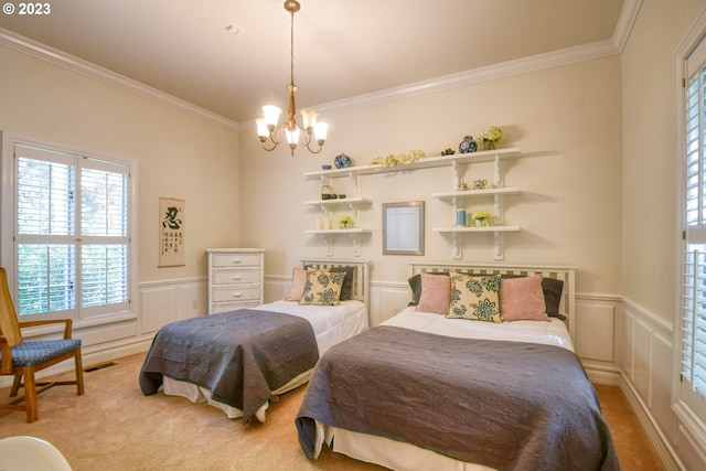 carpeted bedroom with crown molding and a chandelier