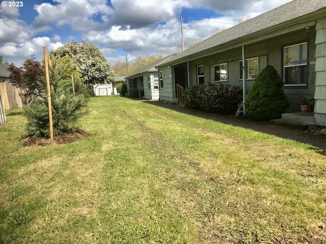 view of yard with a storage shed