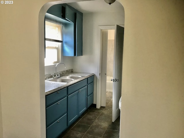 bathroom featuring tile flooring and vanity