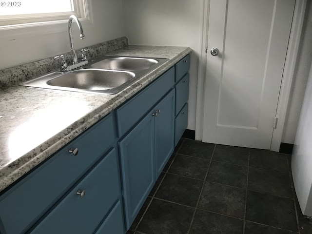 bathroom with vanity and tile flooring