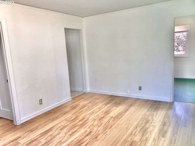 unfurnished room with light wood-type flooring