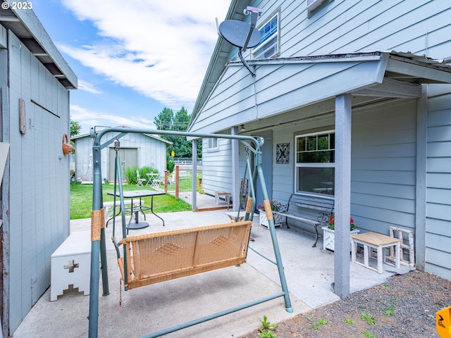 view of patio featuring a shed