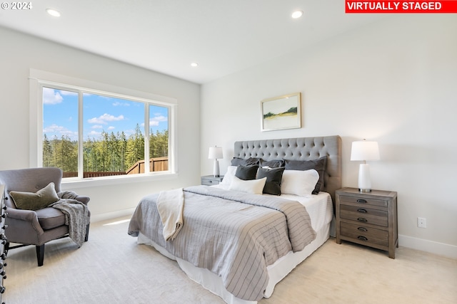 bedroom with light colored carpet