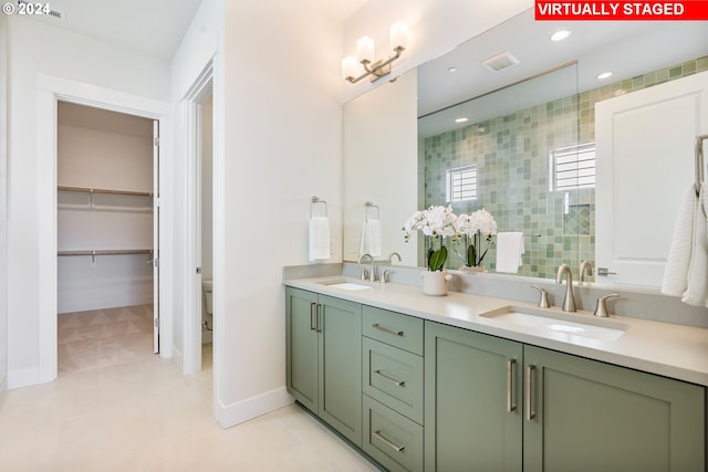 bathroom with vanity, toilet, and walk in shower