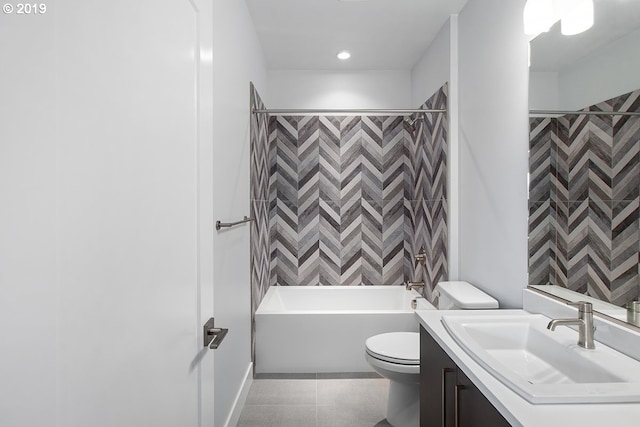 full bathroom with tiled shower / bath combo, toilet, vanity, and tile flooring