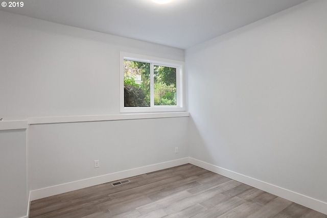 spare room featuring light wood-type flooring