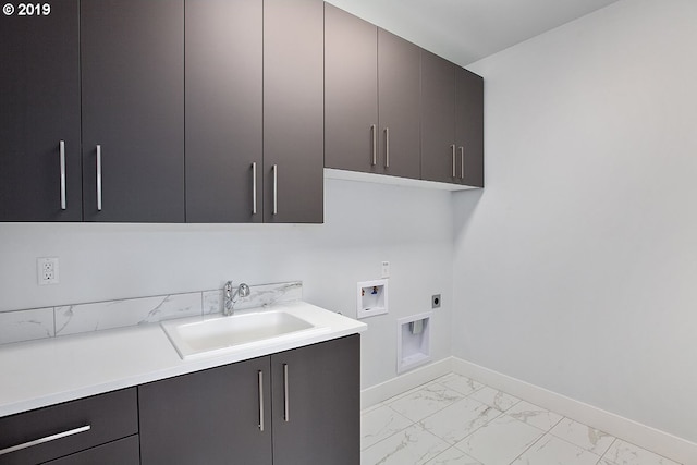 washroom with sink, washer hookup, hookup for an electric dryer, cabinets, and light tile flooring