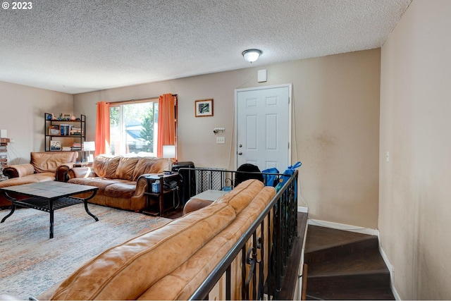 living room with a textured ceiling