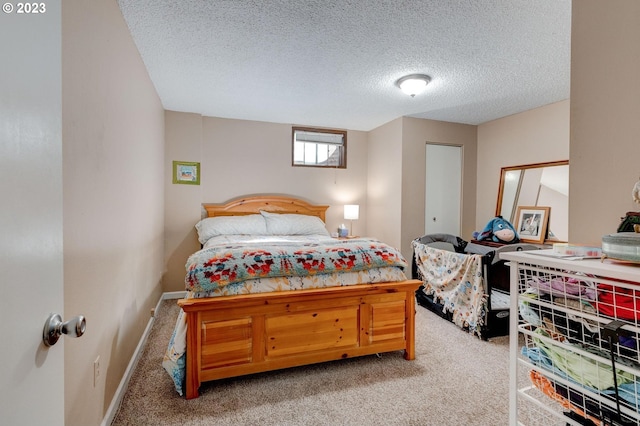 carpeted bedroom with a textured ceiling