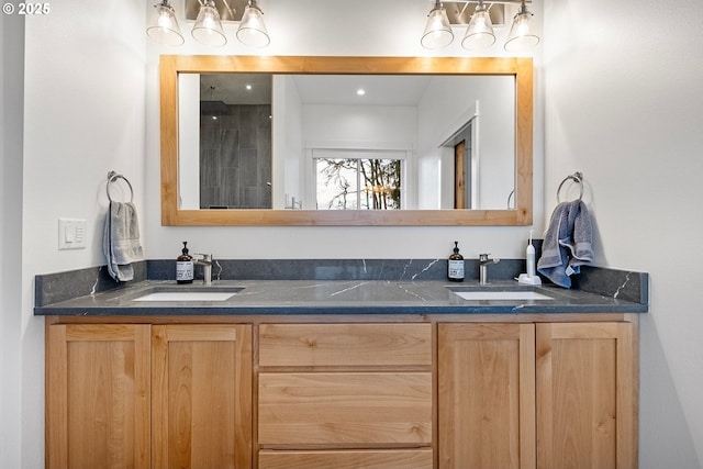 bathroom with double vanity and a shower