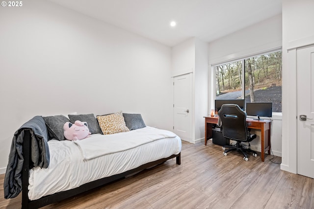 bedroom with wood finished floors, a desk, recessed lighting, and baseboards
