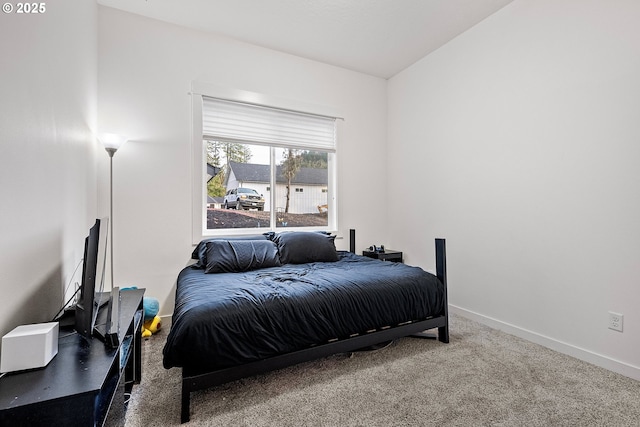 bedroom featuring carpet flooring and baseboards