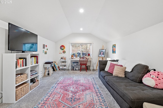 carpeted living room featuring vaulted ceiling