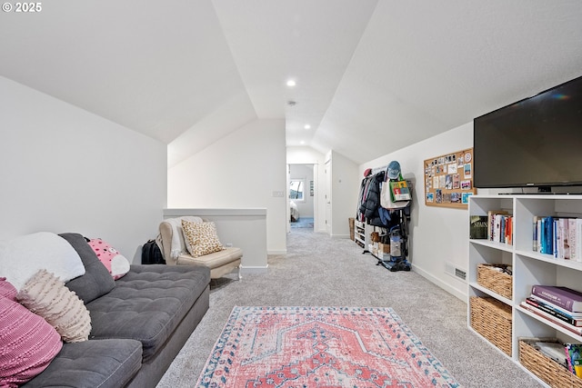 sitting room featuring light carpet and vaulted ceiling