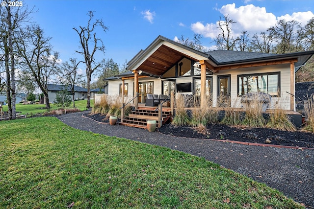 view of front of home with a front yard