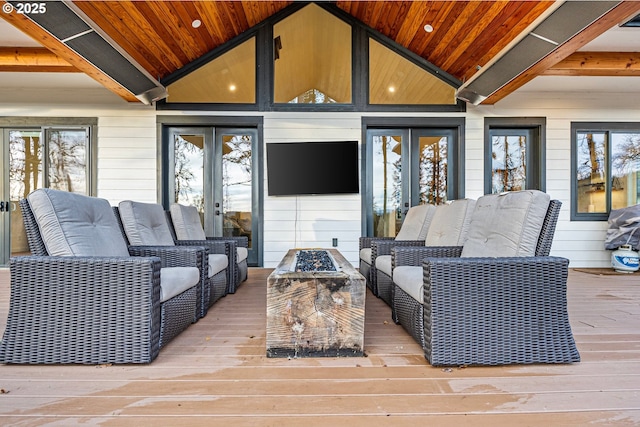 living room with french doors, plenty of natural light, hardwood / wood-style flooring, wooden ceiling, and lofted ceiling